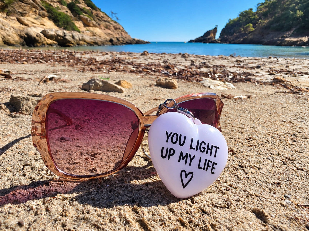 You Light Up My Life heart charm on sunglasses at Mallorca beach